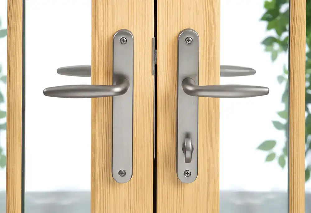 Close up view of French door handles and locking system.