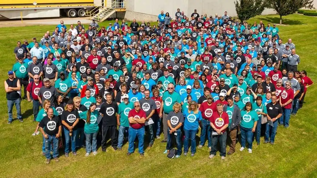 Picture of a big group of Marvin windows employees outside.