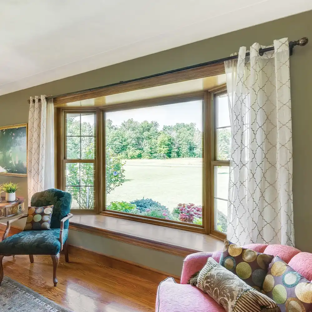 Living room view of a Marvin Replacement Bay window with an EverWood finish.