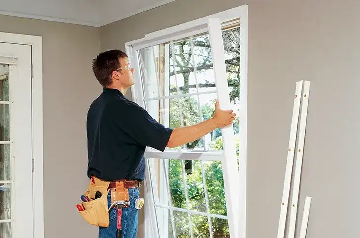 Man prepares to install a Marvin Replacement window