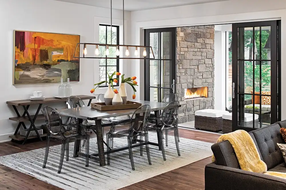 Interior view of a dining room with a four-panel sliding French door.