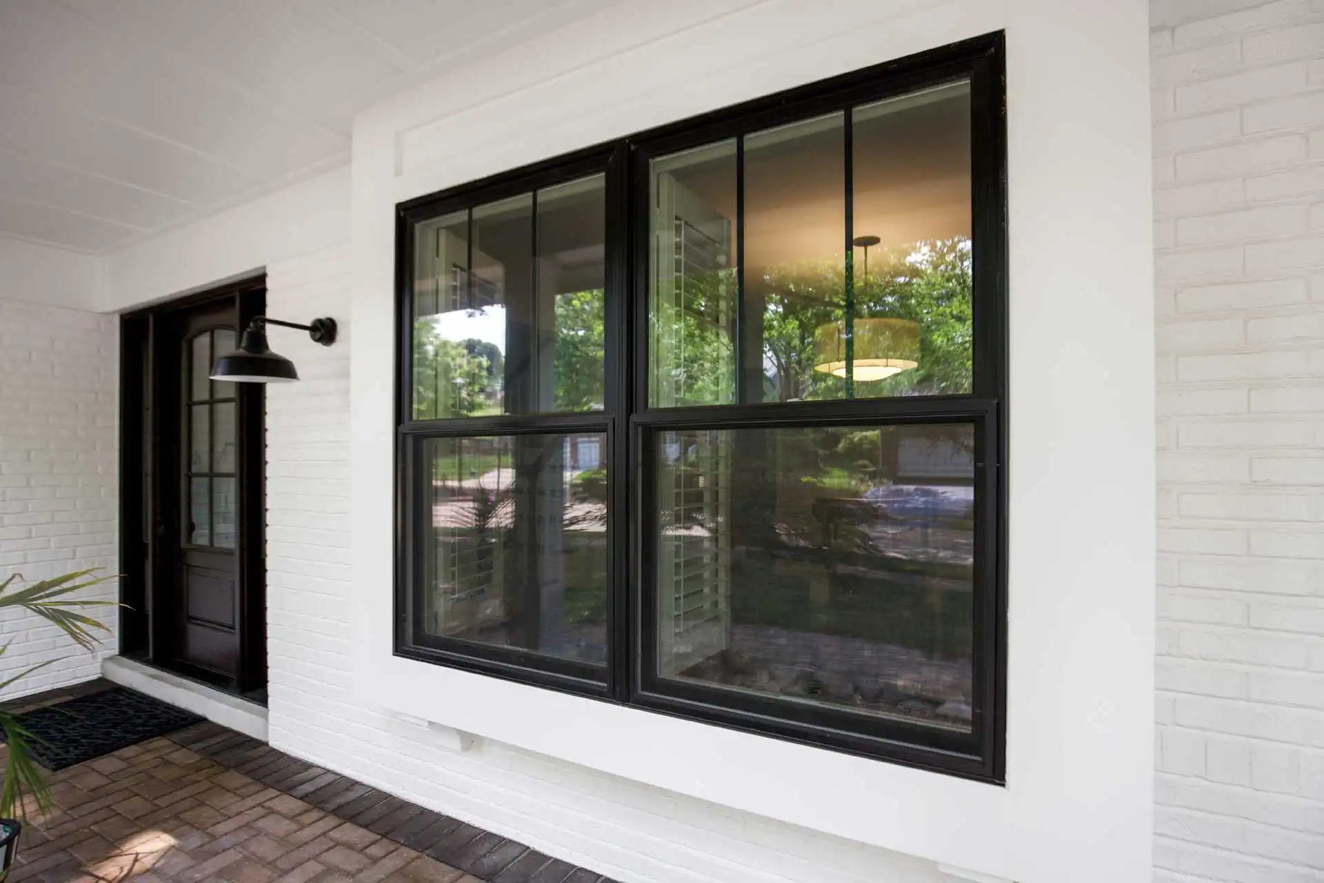 Exterior image featuring Marvin Replacement Double Hung Windows in Ebony exterior finish.