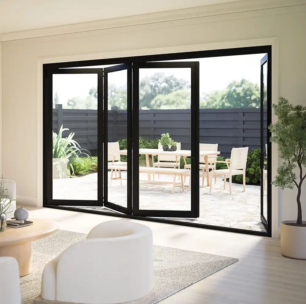 Interior view of a black Marvin Replacement Bi-Fold patio door with a patio in the background.