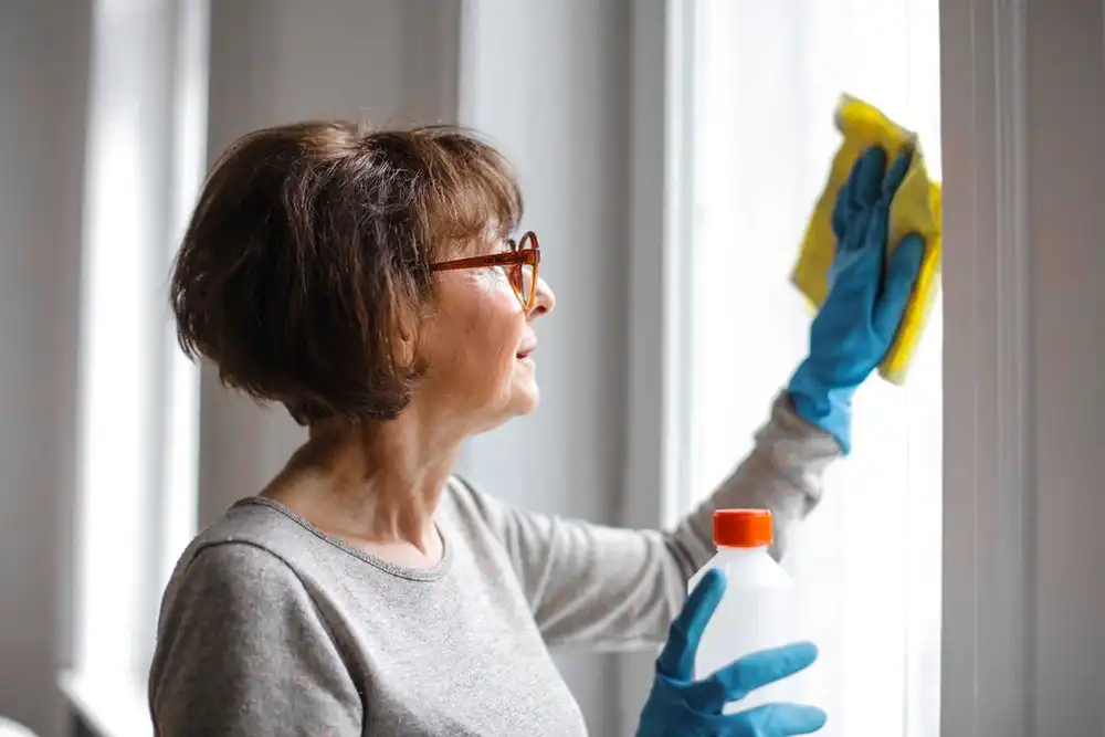 woman cleaning window