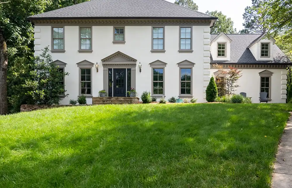 Exterior view of double hung windows in pebble grey