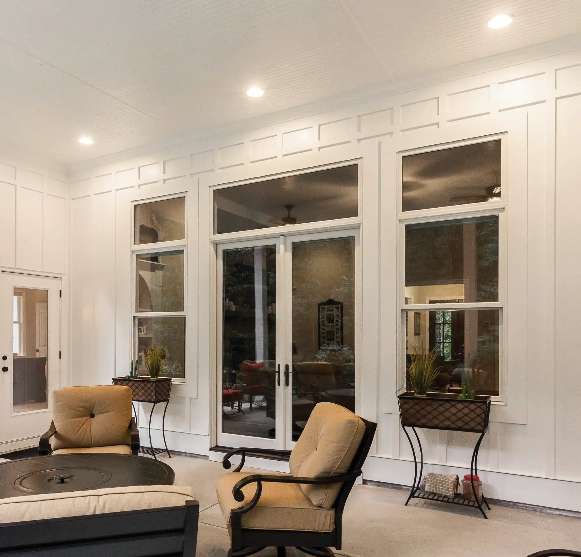 View of white Marvin Replacement Double Hung windows from a porch.