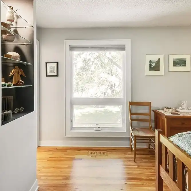 Marvin Replacement Awning window in a bedroom with hardwood floor