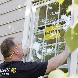 Marvin Replacement window installer places a window