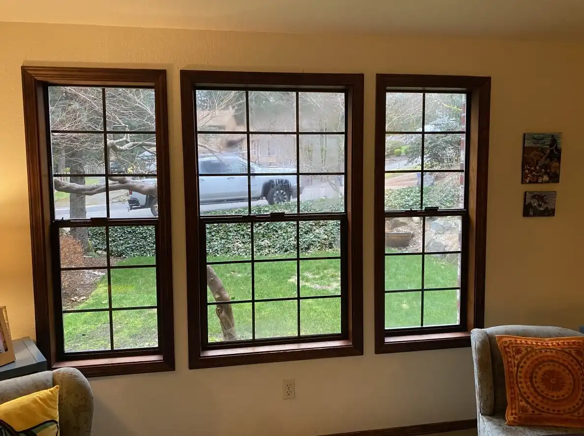 Interior view of foggy wood windows with grids