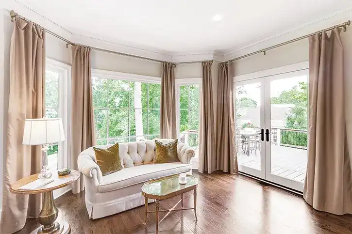 Marvin Replacement Casement and Picture window in a bedroom with an Inswing French door.