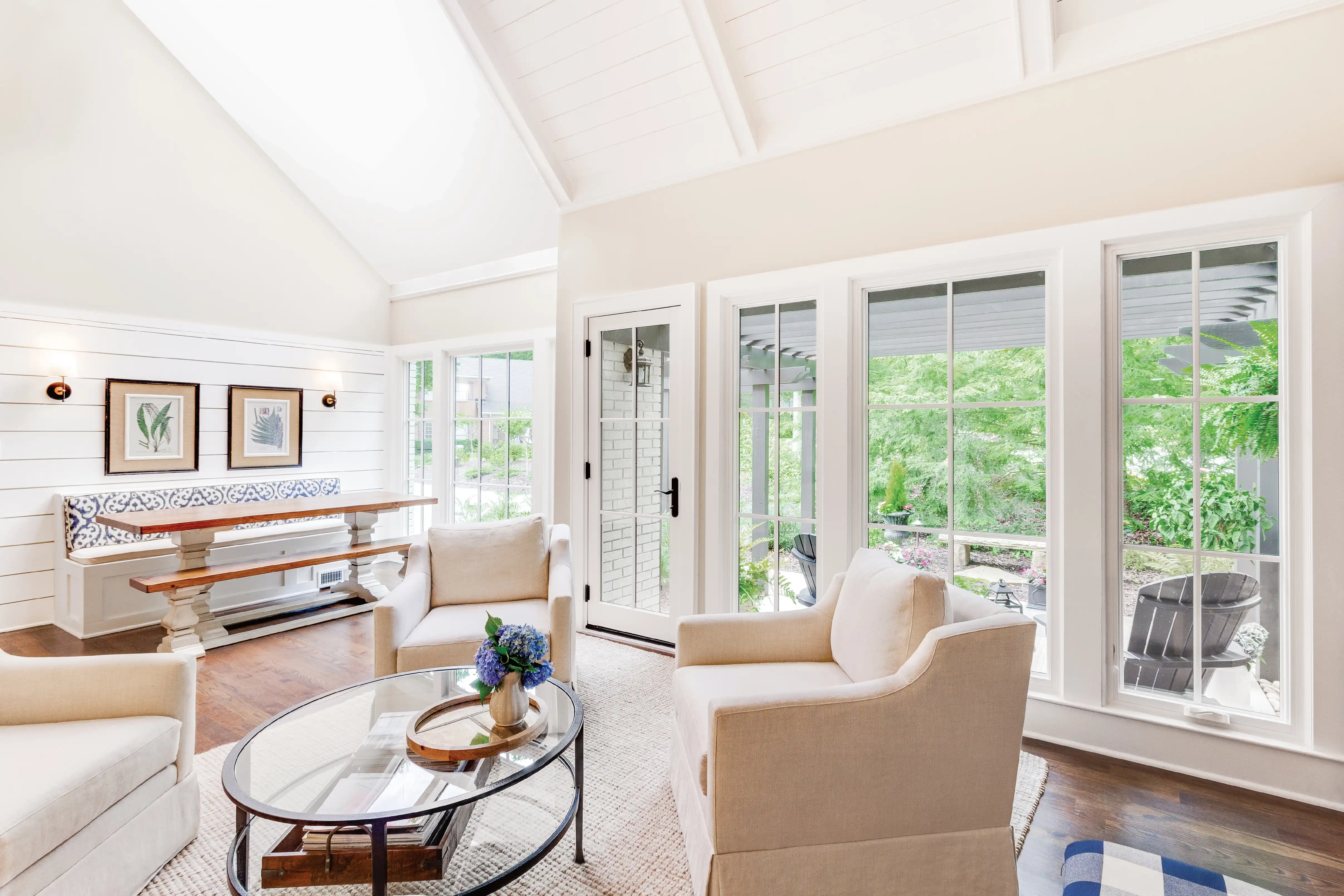 Interior living room image featuring Marvin Replacement Casement and Picture Windows and an Marvin Replacement Inswing French Door in Stone White finish with White and Oil Rubbed Bronze hardware.