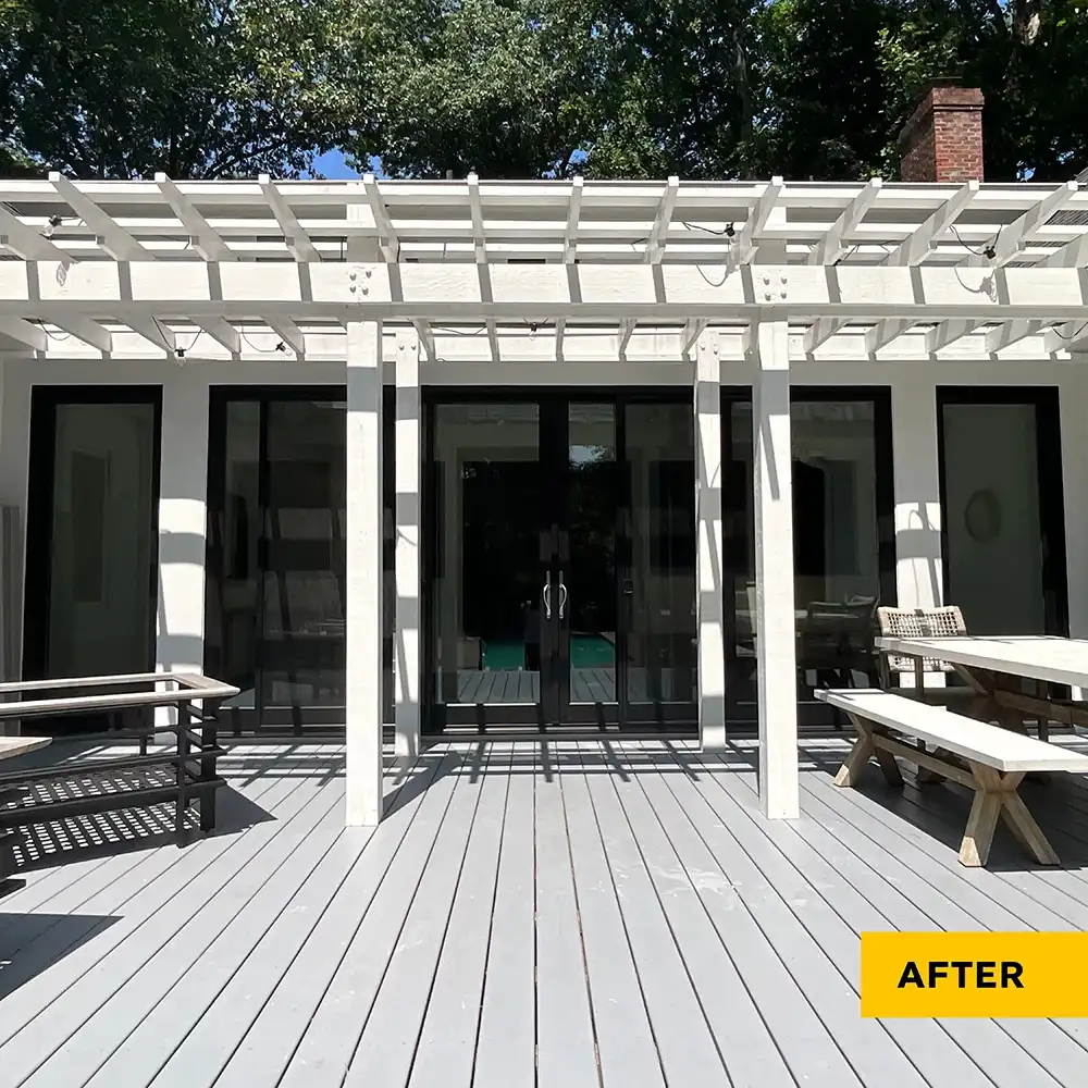 Exterior view of a two-panel Marvin Replacement black sliding French door.