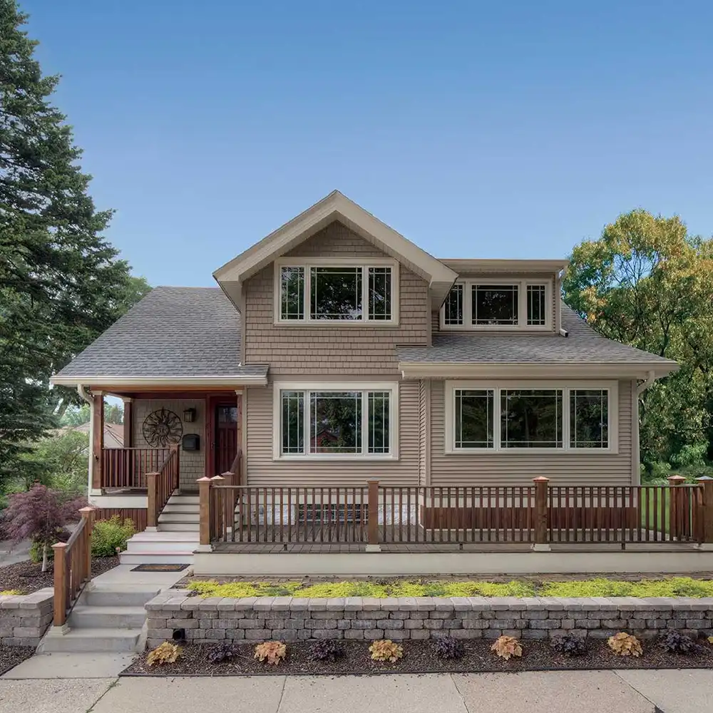 Exterior view of a bungalow home featuring Marvin Replacement windows.