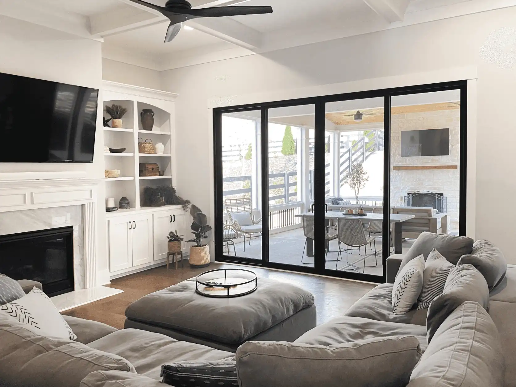 Interior living room image featuring a Sliding Patio Door in Ebony finish with Matte Black Northfield hardware and a Bronze sill.