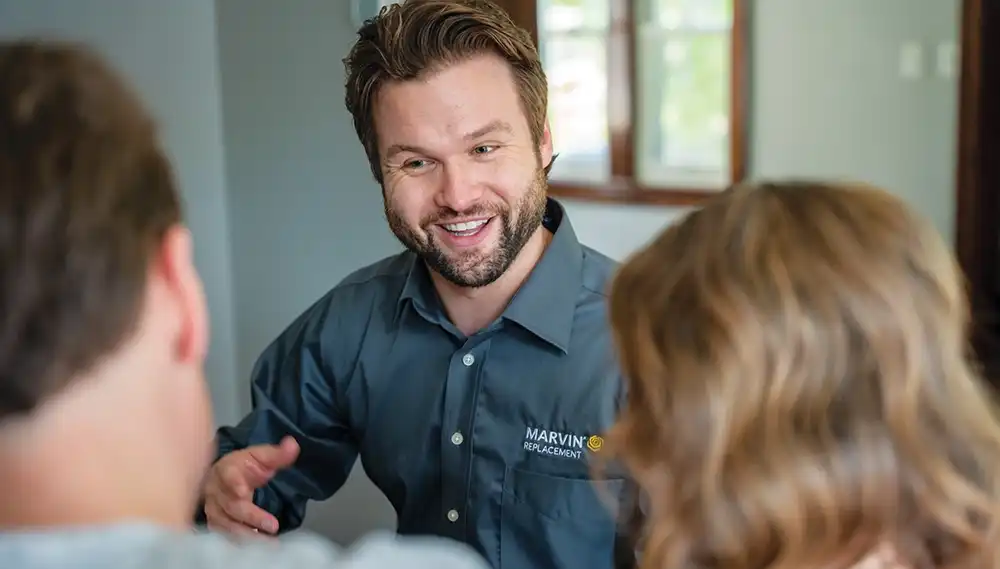 Design Consultant speaking with homeowners