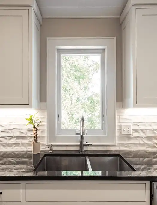 White awning window above a kitchen sink