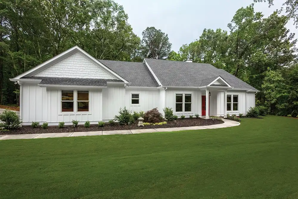 Exterior view of a white Ranch style home