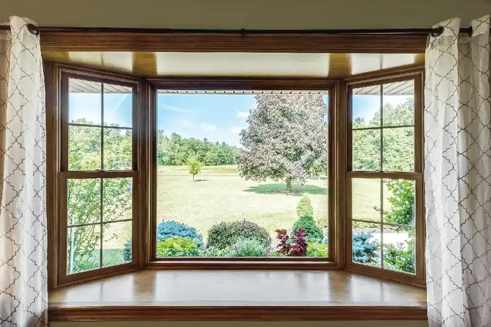 Interior living room image featuring a Marvin Replacement Bay Window and Double Hung Windows.