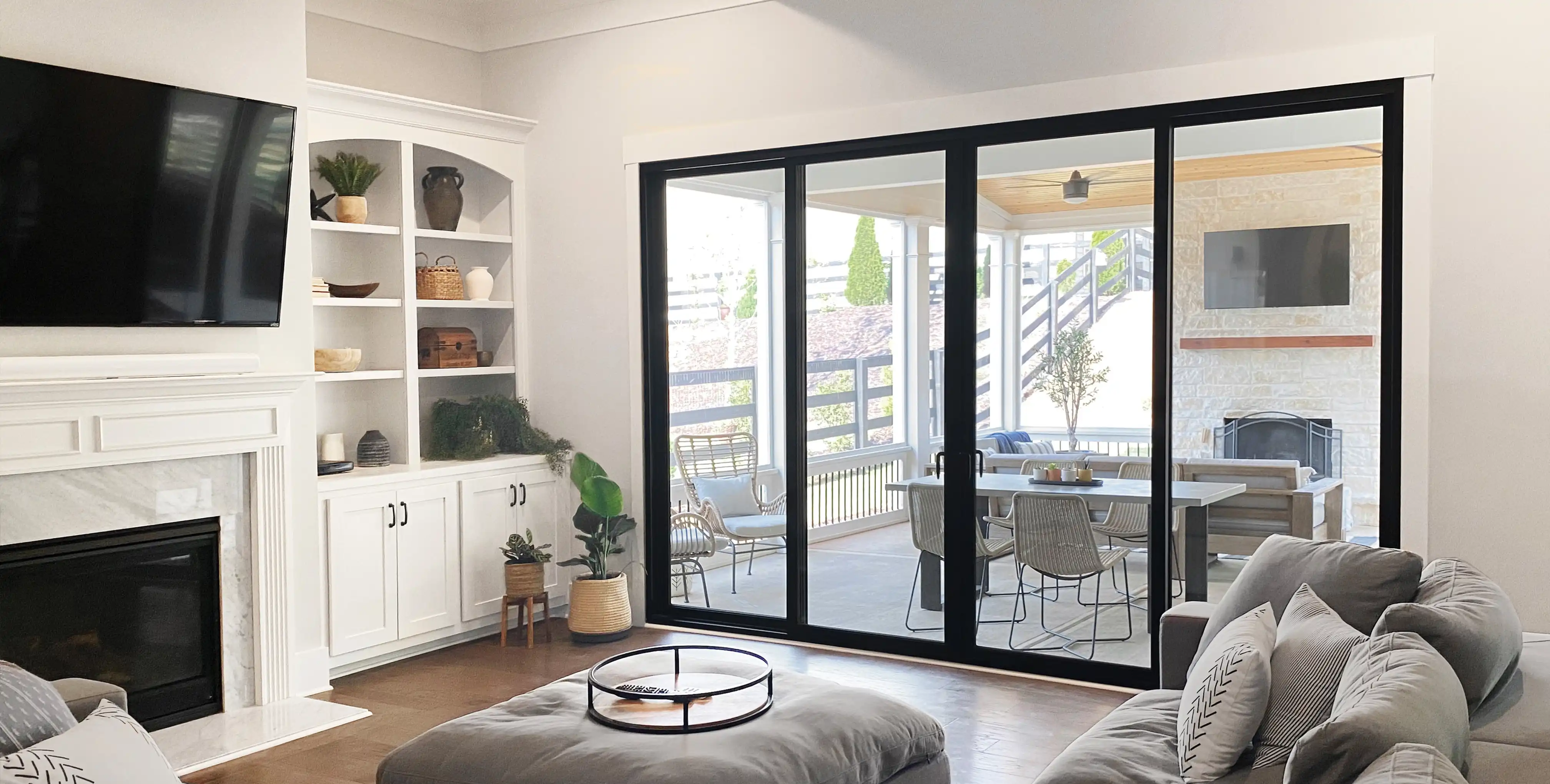 Interior view of a black four-panel Marvin Replacement Sliding French door.