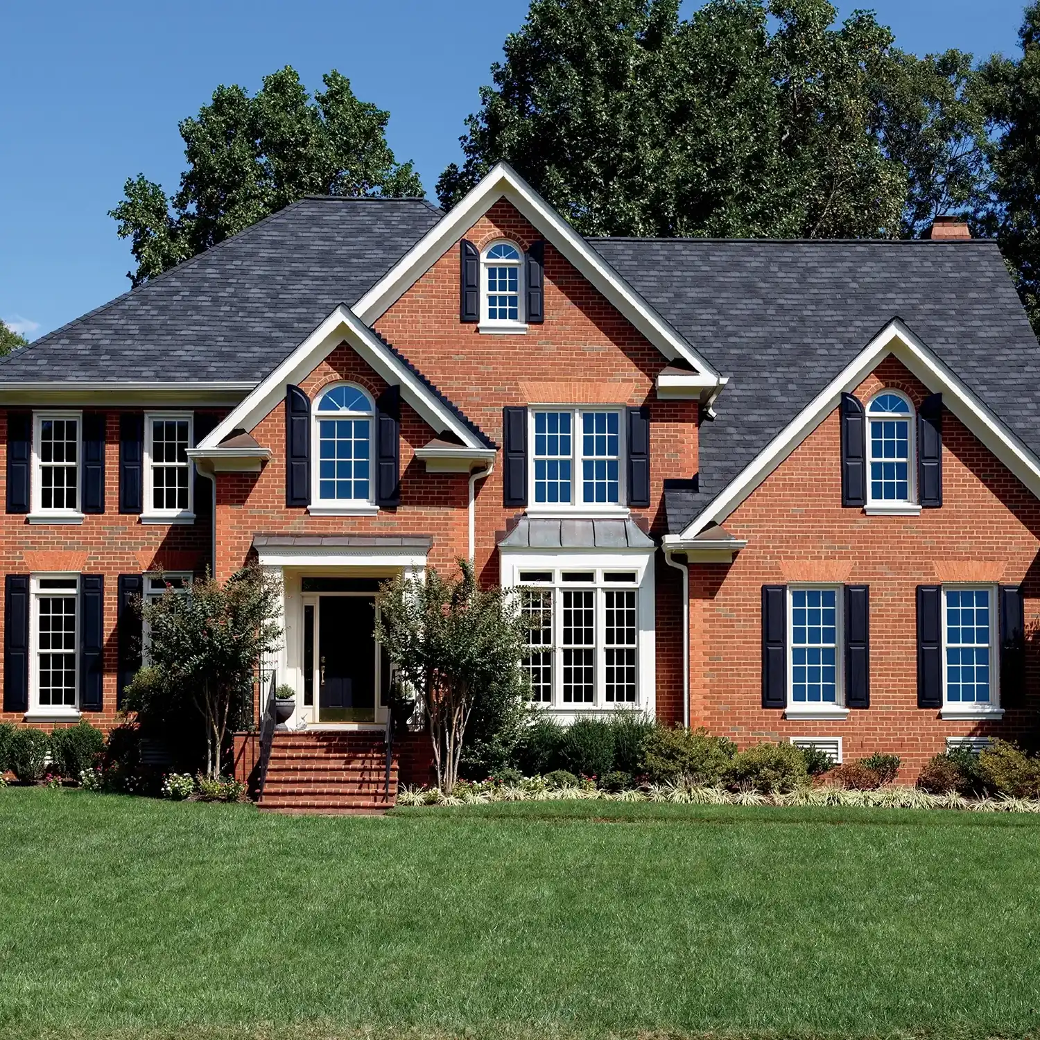 Exterior view of a brick Boston home with Marvin Replacement windows