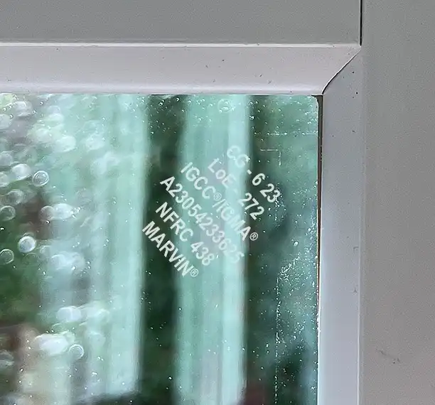 Example of an etching in the corner of a Marvin Replacement window