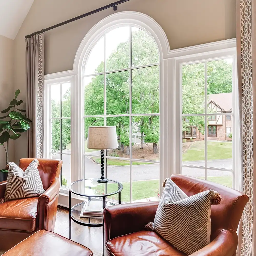 Interior view of a home office with a white round top window.