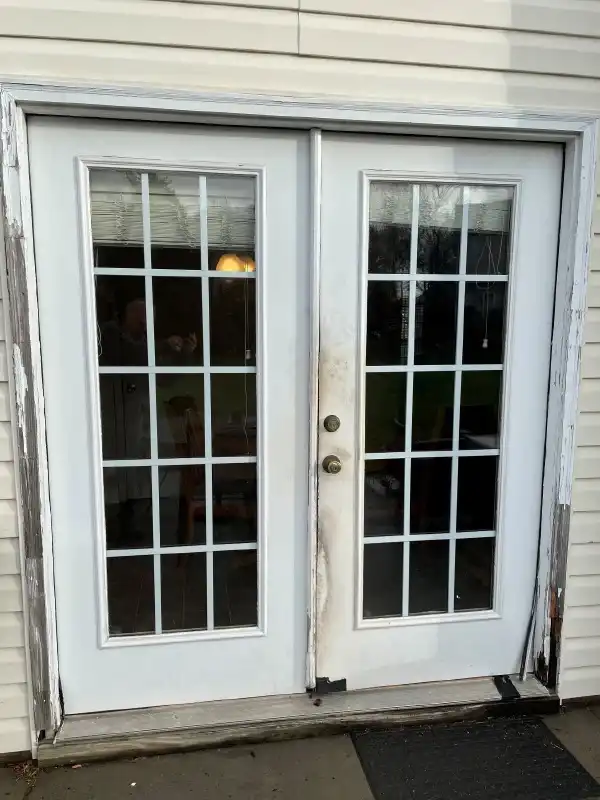 Damaged two-panel french door