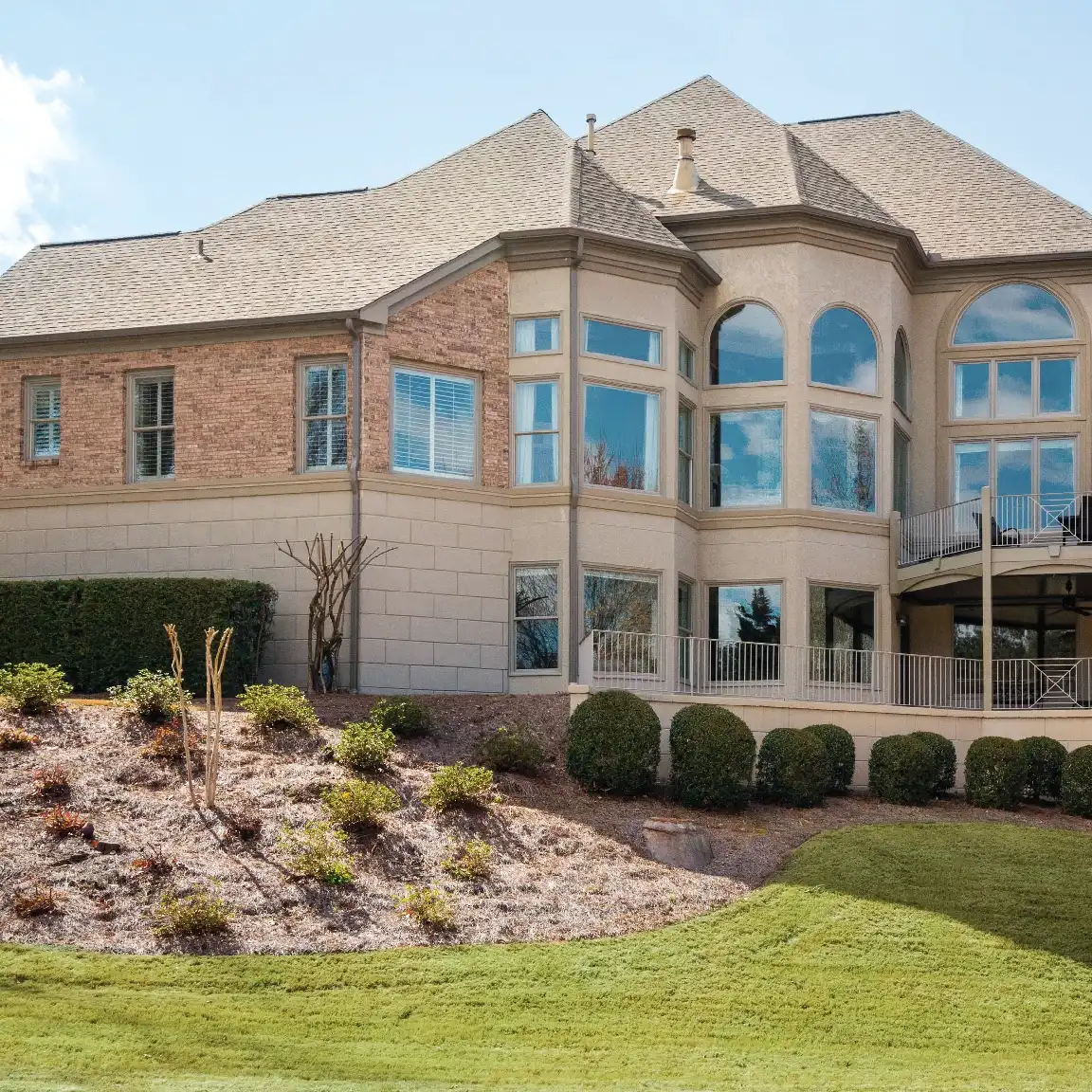 Exterior view of a home with Marvin Replacement round top windows in White Plains, NY.