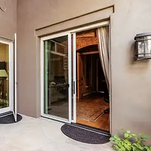 Exterior view of a white Marvin Replacement two-panel Sliding Glass Patio door